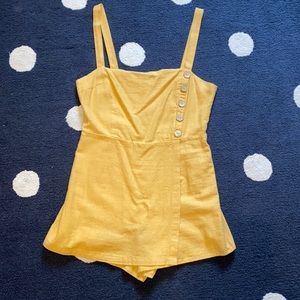 Pale orange romper with button detailing